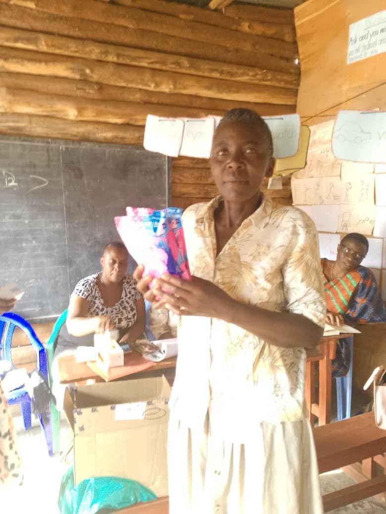 Girls receiving hygiene packs